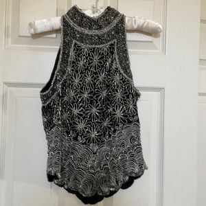 High neck fancy hand beaded evening wear top.